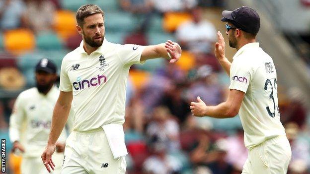 England bowlers Chris Woakes (left) and Mark Wood (right) celebrate