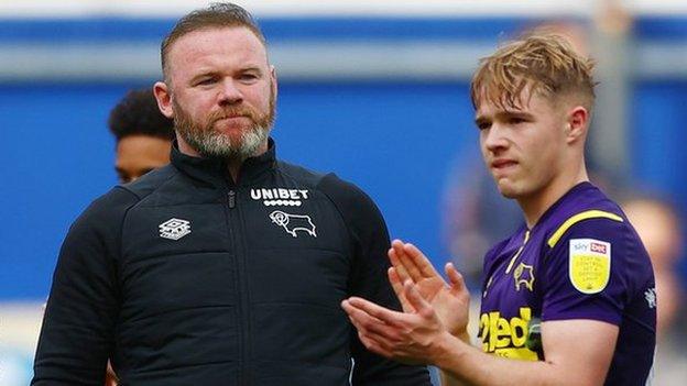 Derby County boss Wayne Rooney looks on