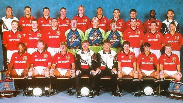 Pat McGibbon pictured with the 1995/96 Manchester United team, standing between David Beckham and Eric Cantona, with Ryan Giggs and Roy Keane just behind him