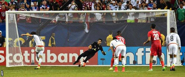 Mexico's Andres Guardado scores the winning penalty