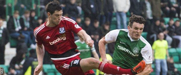 Ayr's Scott McKenna tackles Hibs' John McGinn