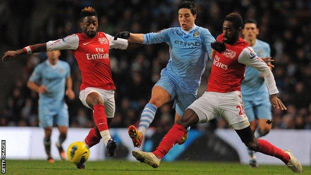 Alex Song and Johan Djourou