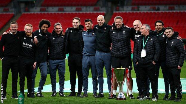 Richie Wellens and his coaching staff celebrate Salford's 2019-20 EFL Trophy final success