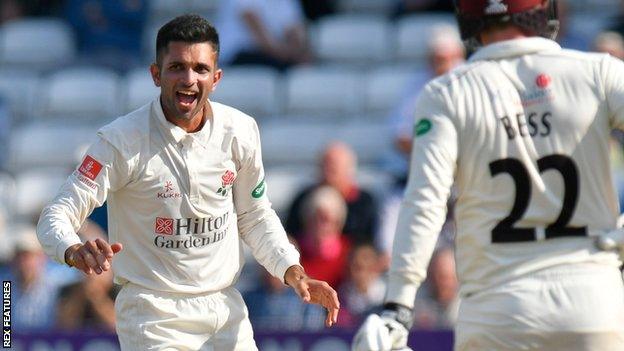 Lancashire's Keshav Maharaj celebrates a wicket at Taunton