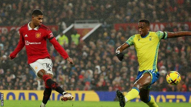 Marcus Rashford sweeps in Manchester United's first goal against Nottingham Forest