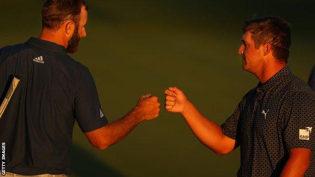 Dustin Johnson and Bryson DeChambbeau fist bump