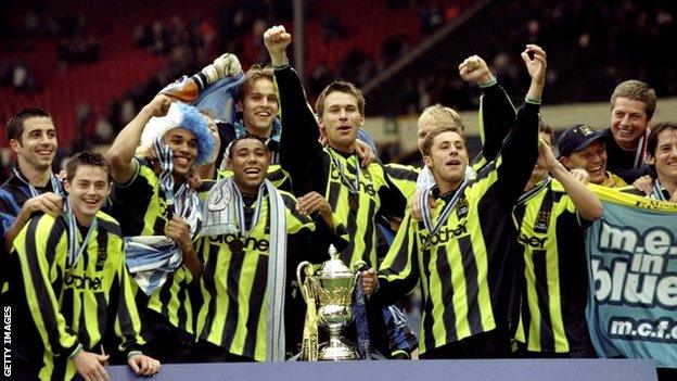 Manchester City football players celebrate achieving promotion in 1999