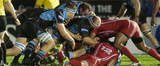 Glasgow Warriors players clear a ruck