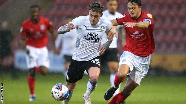 Sammie Szmodics of Peterborough United beats Perry Ng of Crewe Alexandra during the Sky Bet League One match between Crewe Alexandra and Peterborough United at The Alexandra Stadium on 14 November, 2020