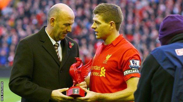 Gary McAllister presents Steven Gerrard an award on his 600th Liverpool appearance