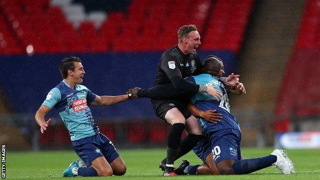 David Stockdale (centre) was on the bench for Wycombe's League One play-off final victory over Oxford United in July