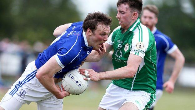 Gearoid McKiernan attempts to get past Aaron Bradley in Ruislip