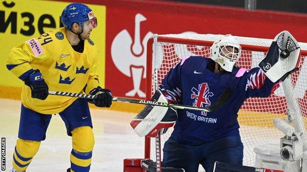 Ben Bowns saves another shot for Great Britain against Sweden at the Ice Hockey World Championships in Latvia