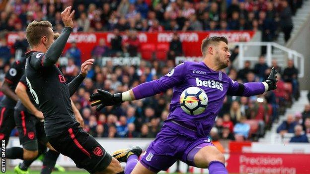 Stoke keeper Jack Butland saves from Arsenal's Aaron Ramsey