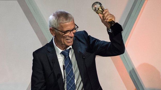 Hector Cuper celebrating the coach of the year award