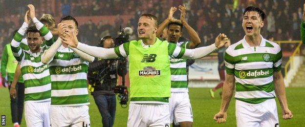 The Celtic players celebrate at full-time