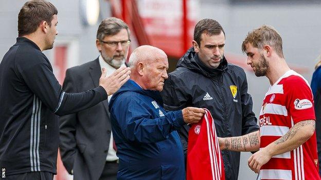 Hamilton's David Templeton (right) comes off injured against Hearts