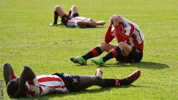 Dejected Brentford players