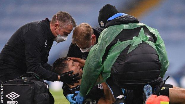 Burnley's James Tarkowski receiving treatment for a head injury