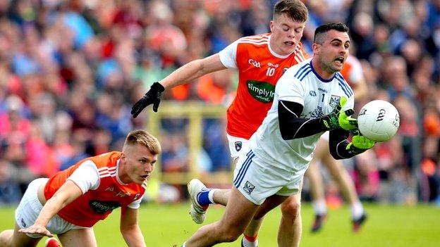 Orchard duo Rian O'Neill and Aiden Nugent can't prevent Breffni keeper Raymond Galligan getting the ball away