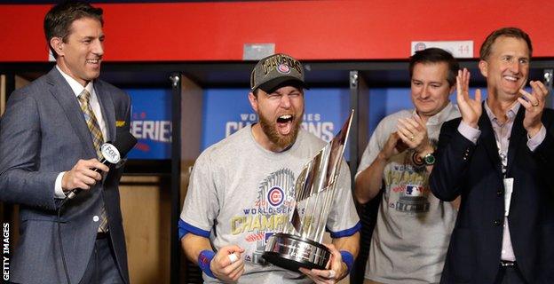 Ben Zobrist #18 of the Chicago Cubs celebrates with the 2016 World Series Most Valuable Player (MVP) Award