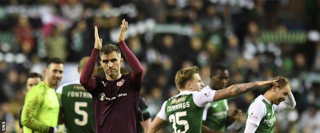 Hearts' Aaron Hughes claps the away supporters at full-time