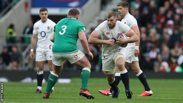 England's George Kruis runs with the ball against Ireland