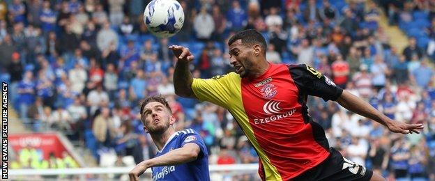 Craig Noone watches Birmingham's David Davis head the ball