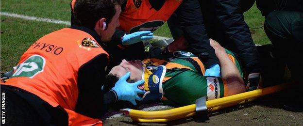 George North is treated after being hurt playing for Northampton in March 2015