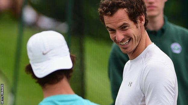 Andy Murray shares a joke during practice at Wimbledon