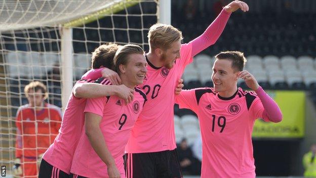 Scotland scorers Jason Cummings and Oliver McBurnie celebrate