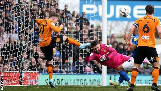 Keane Lewis-Potter clears off the line for Hull against Birmingham