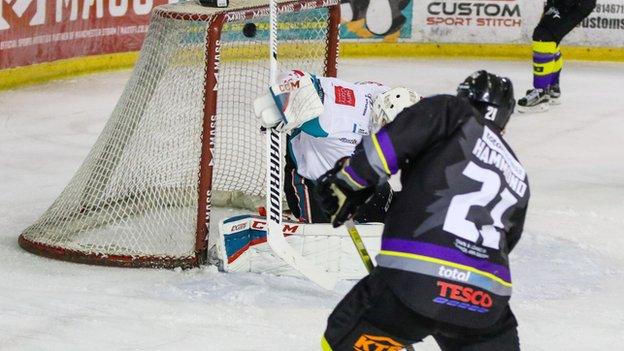 Mike Hammond hits high into the Giants net but the visitors came out on top at the Manchester Ice Centre