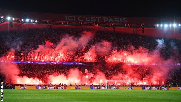 Paris St-Germain fans light flares