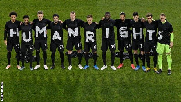 Germany support migrant workers' rights in a World Cup qualifier in March