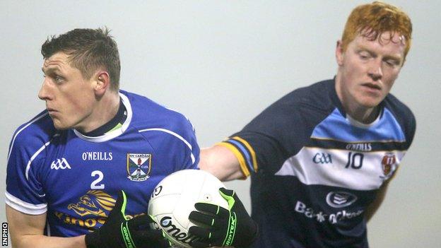 Fergal Reilly of Cavan in action against UUJ opponent Matthew Walsh