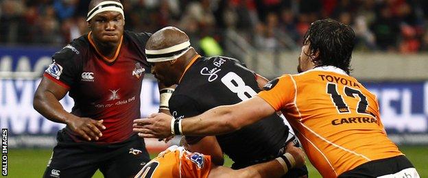 Southern Kings' Andisa Ntsila is wrapped up by Fred Zeillinga of the Cheetahs during the Super Rugby match at Nelson Mandela Bay Stadium