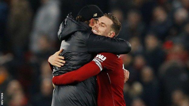 Jordan Henderson hugs Jurgen Klopp at full-time