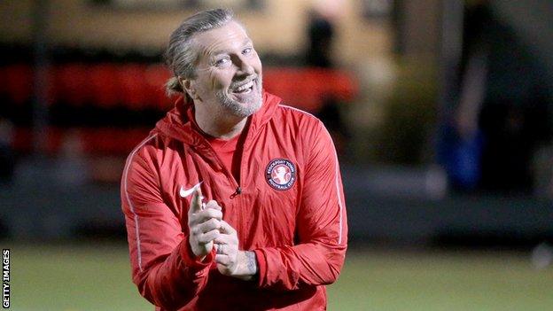 Robbie Savage warming up with Stockport Town