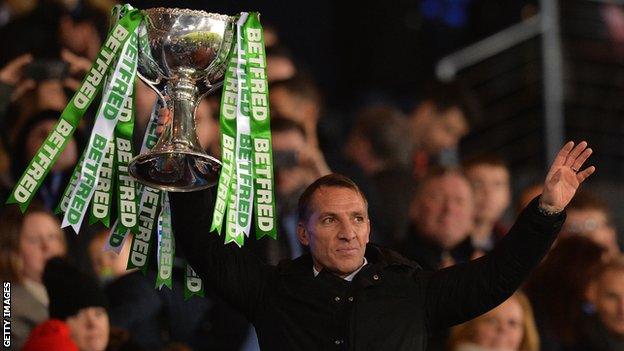 Brendan Rodgers lifts the Scottish League Cup in front of supporters after Celtic beat Aberdeen 1-0 in the final at Hampden Park in December