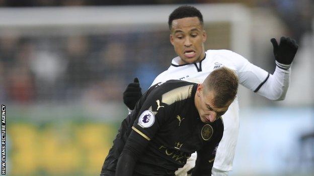 Swansea defender Martin Olsson challenges Leicester's Marc Albrighton during the Foxes' 2-1 win