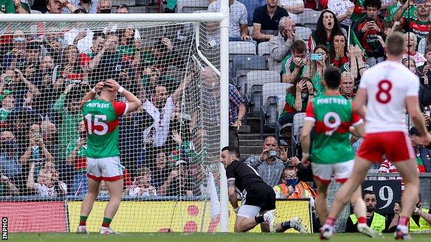 Ryan O'Donoghue holds his head in his hands after his penalty miss