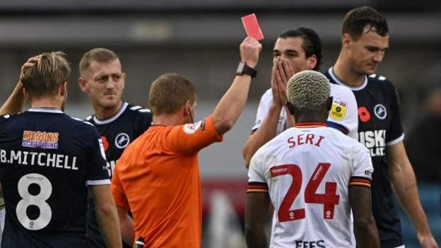 Hulls City's Oscar Estupinan is sent off for a high challenge on Millwall defender Charlie Cresswell