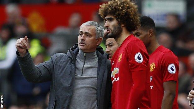 Manchester United's manager Jose Mourinho and midfielder Marouane Fellaini