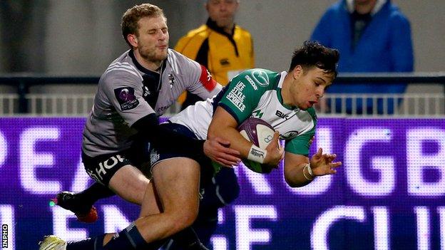 Rory Parata scores Connacht's early try despite the efforts of Brive's Guillaume Namy