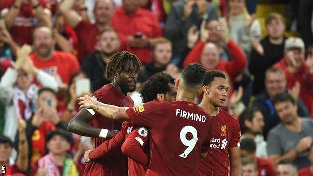 Divock Origi is congratulated by Liverpool players after scoring against Norwich