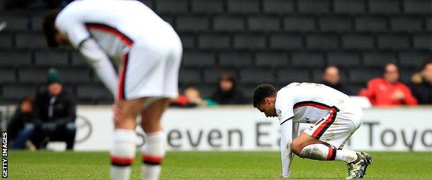 Josh Murphy falls to the ground after the final whistle