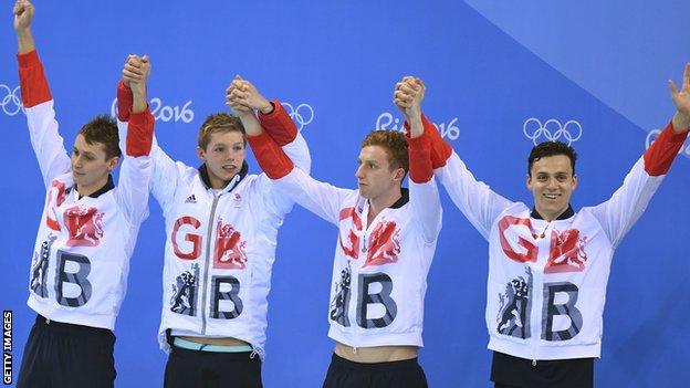 Stephen Milne, Duncan Scott, Dan Wallace celebrate on the podium, along with James Guy