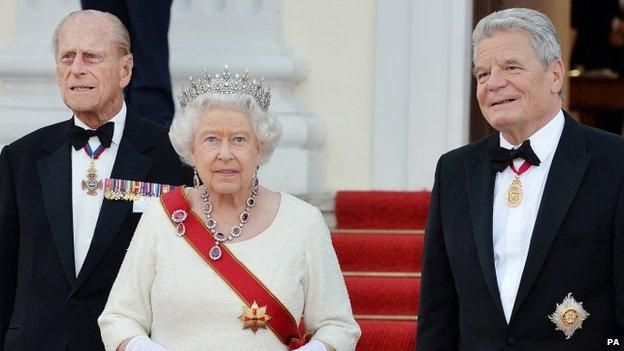 The Queen and the Duke of Edinburgh arrive for a state banquet hosted by President Gauck (right) of Germany