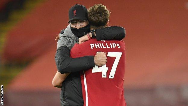 Jurgen Klopp hugs Nathaniel Phillips